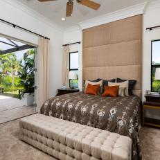 Guest Bedroom With Floor-to-Ceiling Headboard And French Doors 