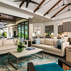 Grand Living Space With Vaulted Ceilings And Comfortable Couches