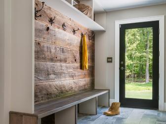 "The mudroom is the workhorse room of a home," explains Nancy Epstein, Founder and CEO of Artistic Tile. She suggests choosing products that are resistant to dirt and messes, easy to clean and won't stain, such as ceramic or porcelain tile. Here, tile meant to resemble reclaimed wood, which is much easier to clean than the real thing, decorates an accent wall. 