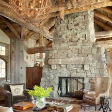 Elegant Rustic Stone Fireplace With Wooden Chandelier