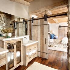 Rustic Master Bath With Sliding Barn Door To Bedroom