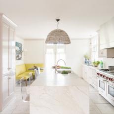 White Chef Kitchen With Yellow Banquette