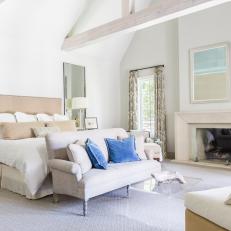 Neutral Transitional Master Bedroom With Blue Pillows