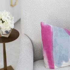 Striped Armchair and Pink Pillow