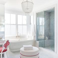 Gray Spa Bathroom With Red Chair