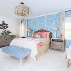 Blue Transitional Bedroom With Orange Pillows