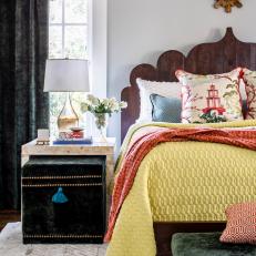 Eclectic Bedroom With Velvet Ottoman