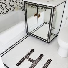 Black and White Kids Bathroom With Mirrored Vanity