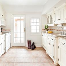 White Cottage Kitchen With Arched Windows