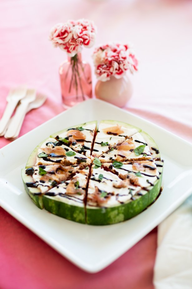 A Watermelon Pizza Topped With Goat Cheese and Proscuitto 