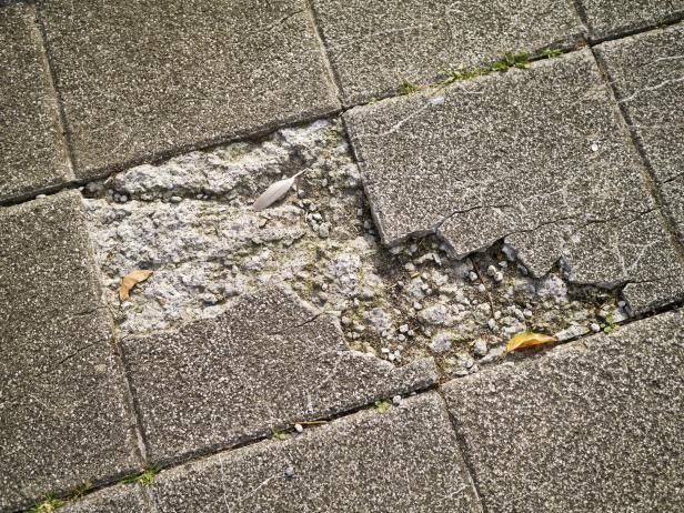 Crumbling asbestos tiles.