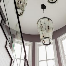 Eclectic Stairway with Dramatic Light Fixtures