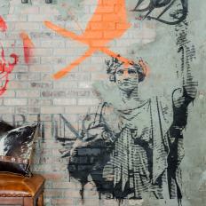Exposed Brick Wall with Graffiti Art