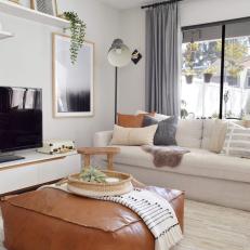 Neutral Contemporary Living Room With Leather Ottoman