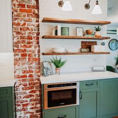 Green Kitchen With Exposed Red Brick