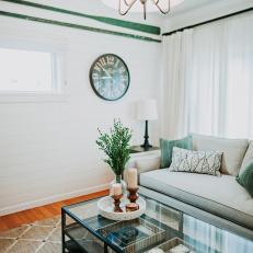 Living Room With White Shiplap And Green Accents