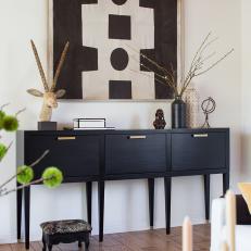 Black Console Table and Art