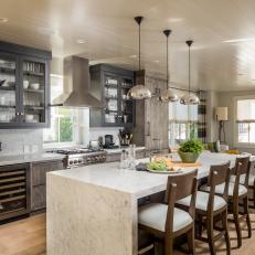 Open Plan Neutral Kitchen With Gray Cabinets