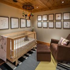 Rustic Nursery With Brown Chair