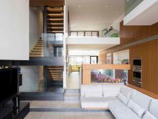 View From The Couch Facing Fish Tank and Open Design Staircase