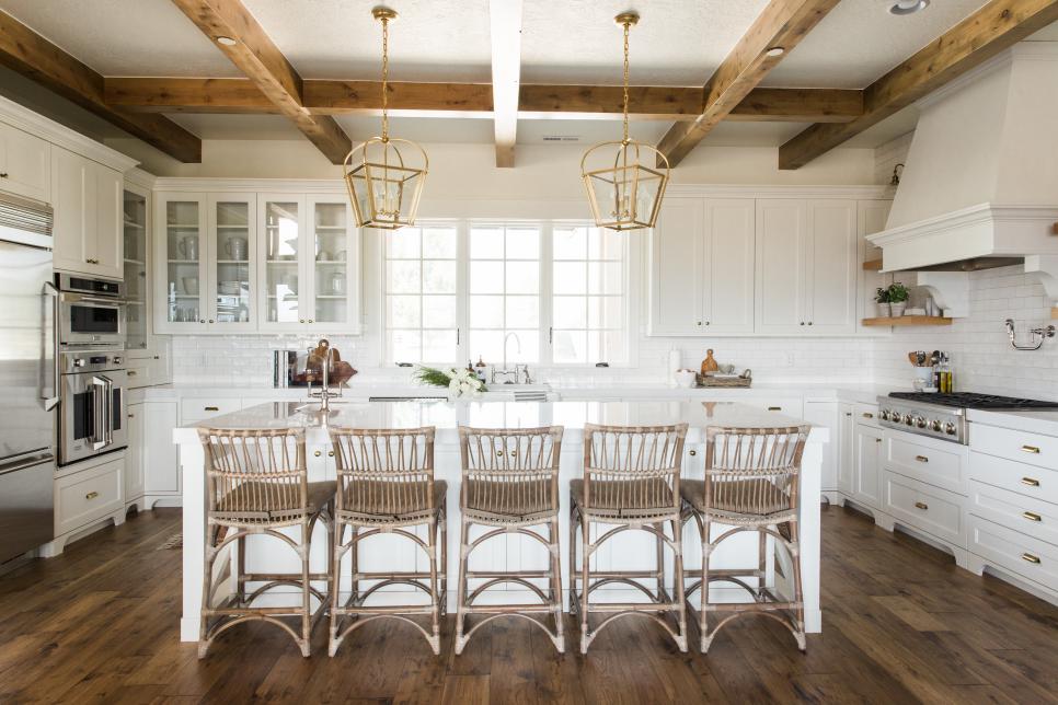 Wide View Of Kitchen With Exposed Wooden Beams And Large Island
