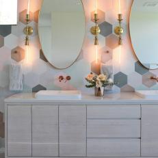 Pastel Bathroom With Brass Sconces