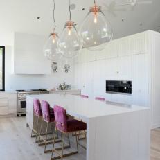 White Chef Kitchen With Pink Furry Stools