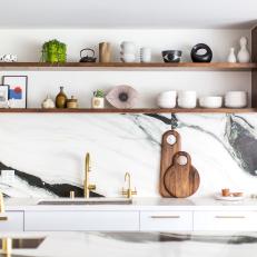 Modern Kitchen With Floating Shelves And Panda White Marble