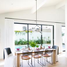 Contemporary Dining Room With Pool View