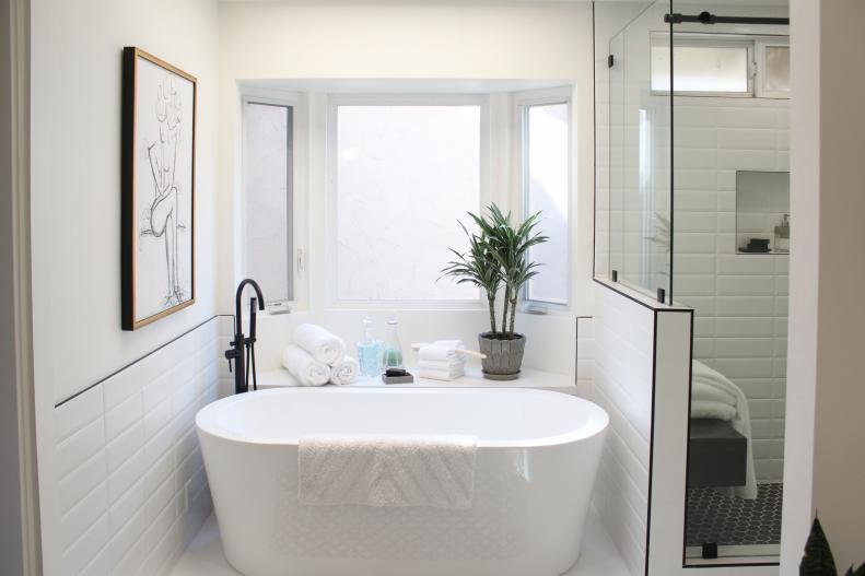 White Master Bathroom with Freestanding White Tub, Glass Shower 