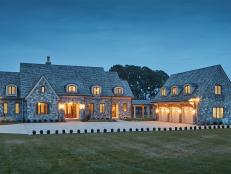 Stone Mansion Exterior and Garage at Night