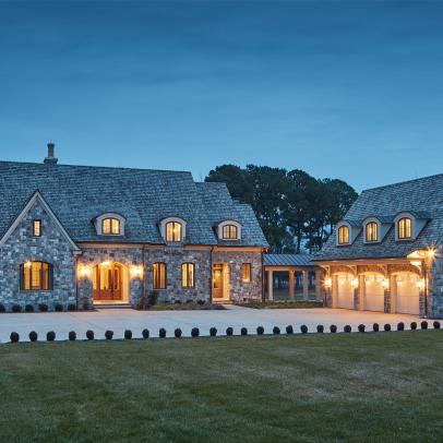 Stone Mansion Exterior and Garage at Night