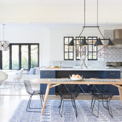 Open Plan Kitchen and Dining Area With Blue Rug