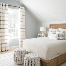 Neutral Transitional Bedroom With Striped Curtains