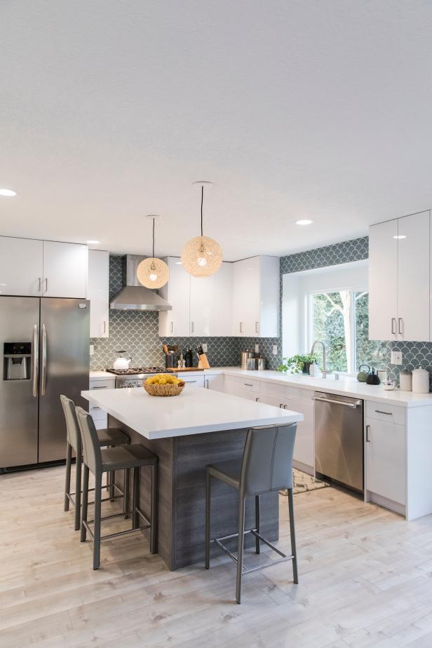 Modern White Kitchen with Gray Island and Gray Chairs | HGTV