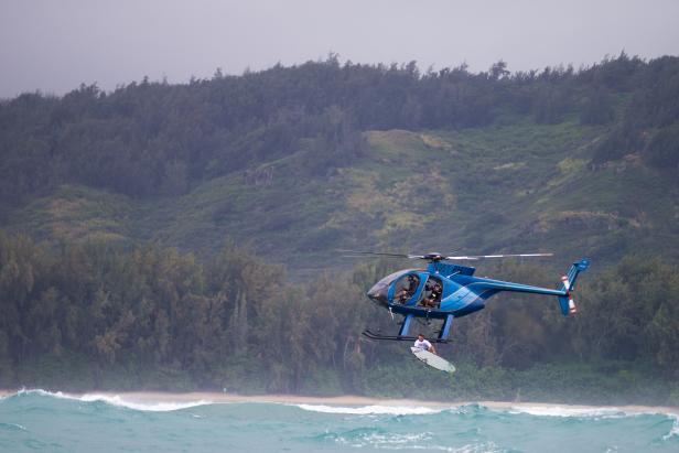 Surfer Nathan Fletcher innovated the practice of dropping a surfer into a wave via helicopter.