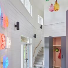 White Contemporary Foyer with Colorful Art, Lighting