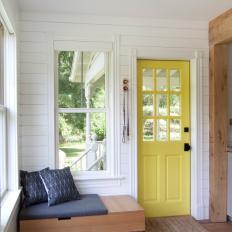 Scandinavian Foyer With Yellow Door