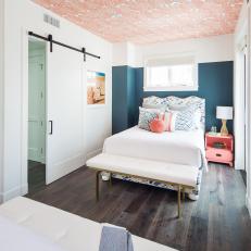 Blue and Pink Guest Bedroom With Barn Door