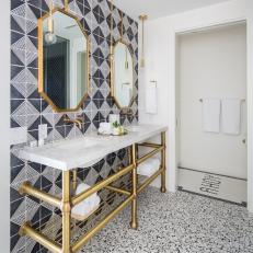 Black and White Master Bathroom With Brass Vanity