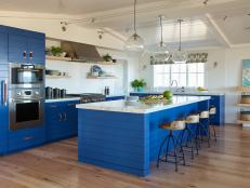 Coastal Style Kitchen With Blue Cabinetry and Large Island