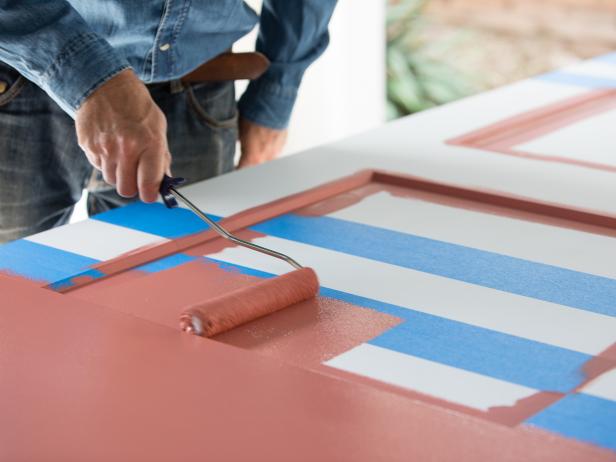 10. Use a small roller to paint the base color on the face of the door.