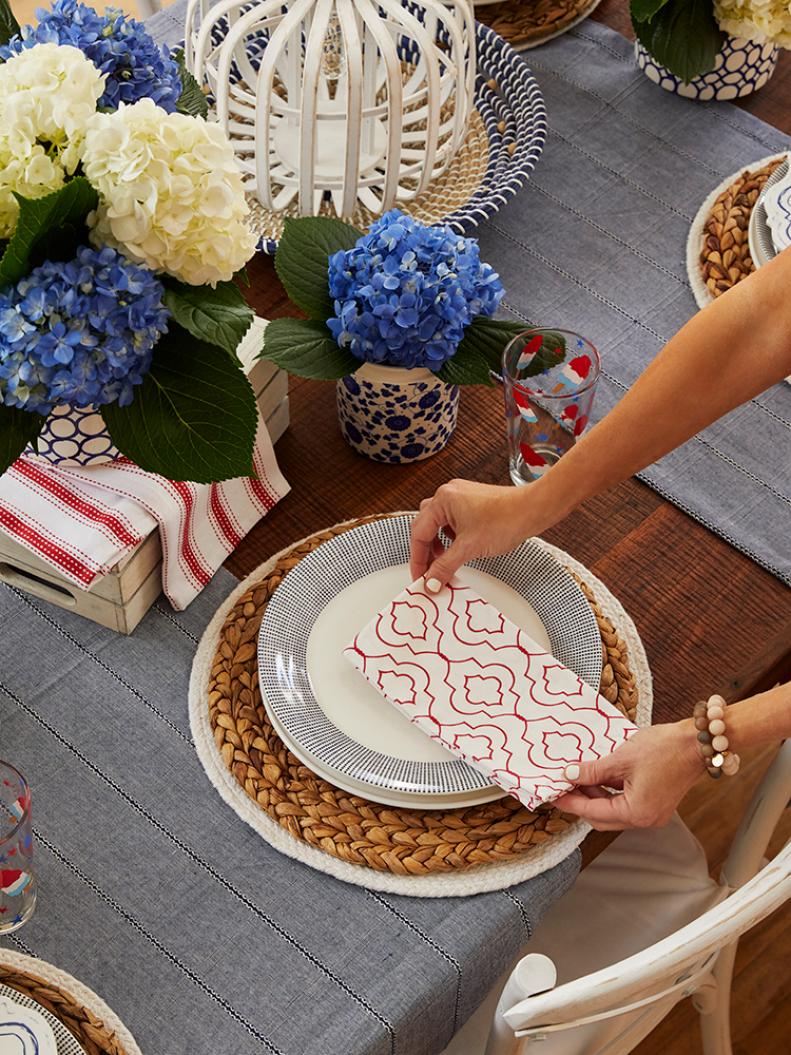 Dish towels aren't just for drying! Instead of using napkins in her place settings, Jenny offers a creative alternative: “I consistently use dish towels as napkins…layering [them] in between dishware so it drapes off the center of the setting,” she explains.

She suggests using towels with fringe, pom poms or designs to add pops of color while incorporating a seasonal theme.