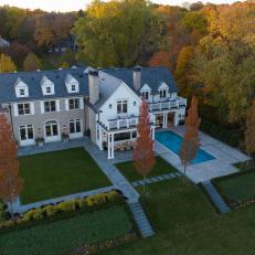 Aerial View of Backyard and Rear of Mansion With Pool
