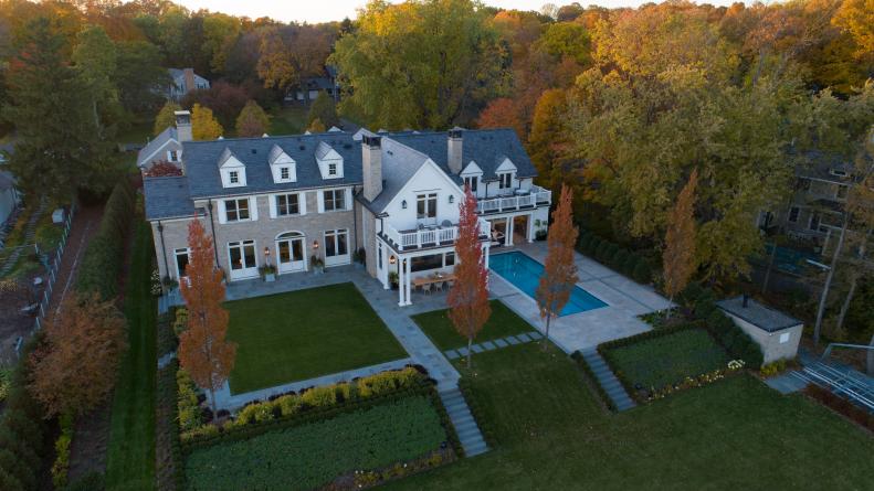 Aerial View of Backyard and Rear of Mansion With Dormer Windows, Pool