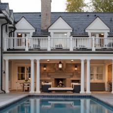 Pool and Covered Patio With Outdoor Fireplace and Balcony