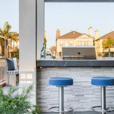 Outdoor Bar With Blue Barstools