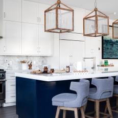 Gray and White Chef Kitchen With Blue Island