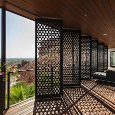 Bifolding Screen Panels Protect Balcony From Hot Desert Sun