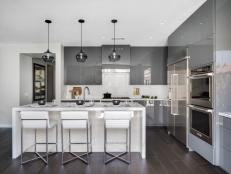 Gray and White Kitchen with Waterfall Island Countertop